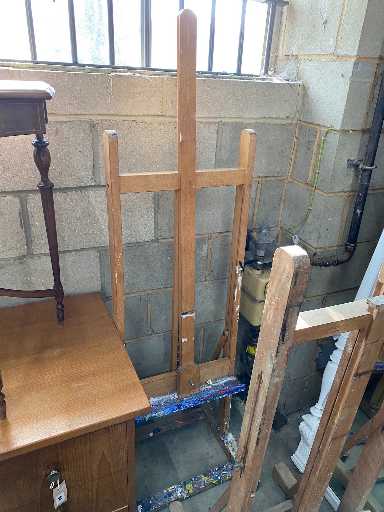 Two artist studio easels